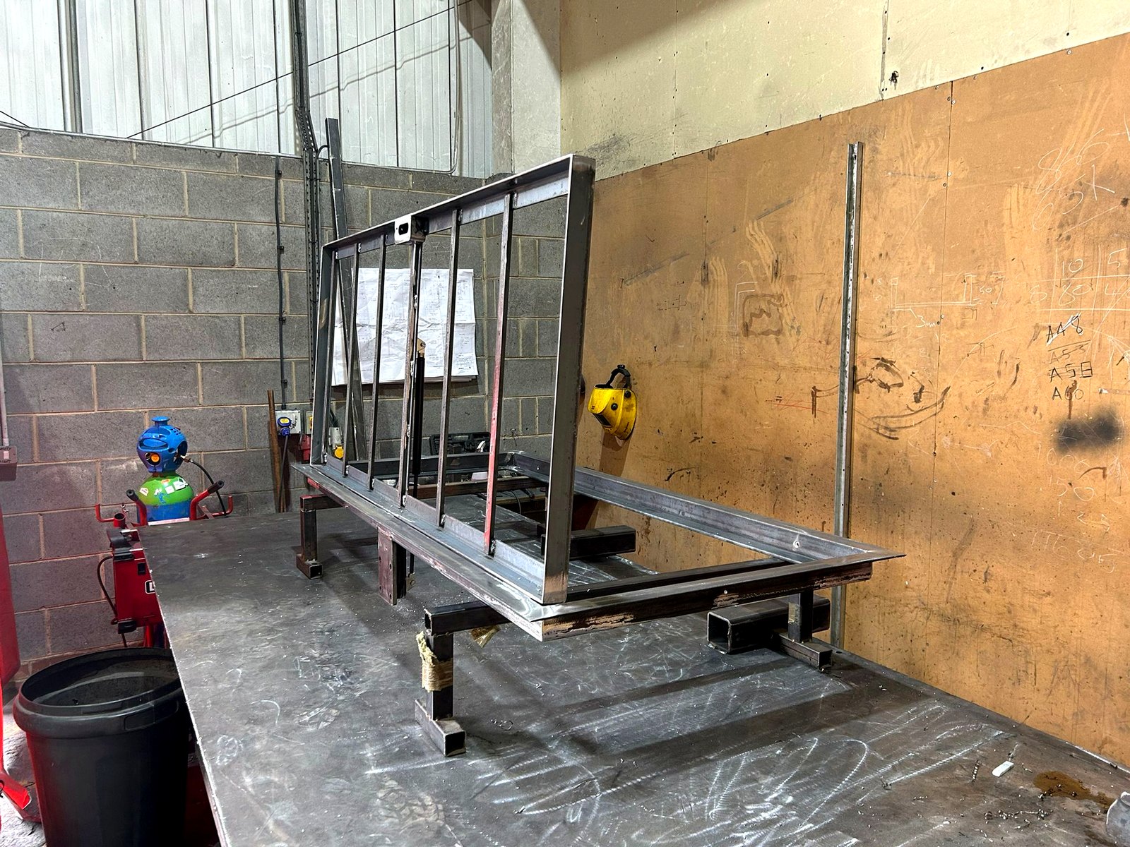 Raw mild steel floor access hatch frame with recessed tray for a tiled infill, before galvanising